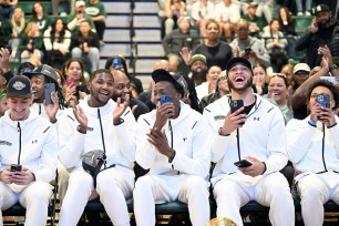 Wagner players react while watching the selection show to learn their fate for the NCAA Tournament.