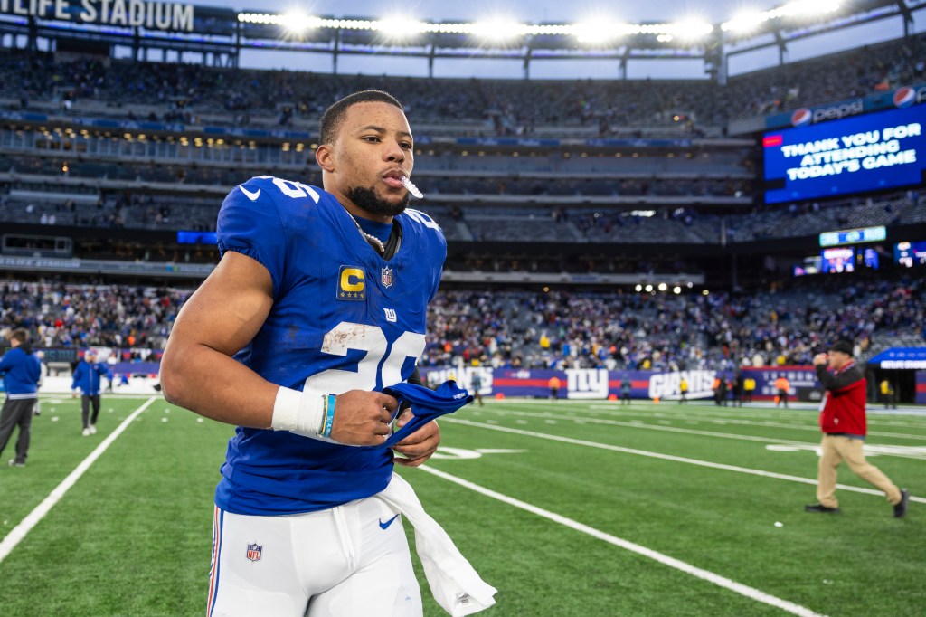 Saquon Barkley #26 of the New York Giants reacts as he walks off the field after a game against the Los Angeles Rams at MetLife Stadium on Dec. 31, 2023, in East Rutherford, New Jersey.  