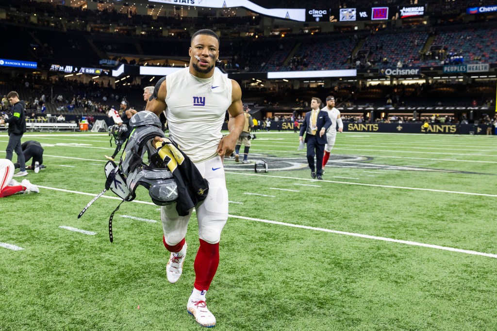 Giants running back Saquon Barkley (26) reacts as he walks off the field after their loss to the New Orleans Saints