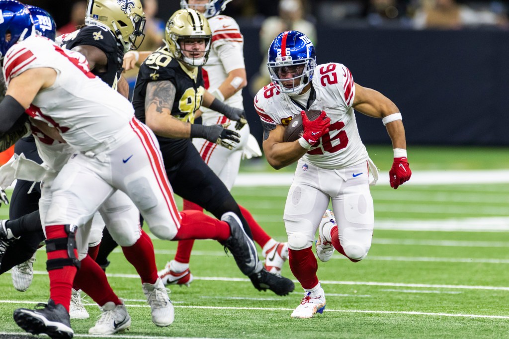 Saquon Barkley of the New York Giants running with the ball during the second half of a game against the New Orleans Saints.