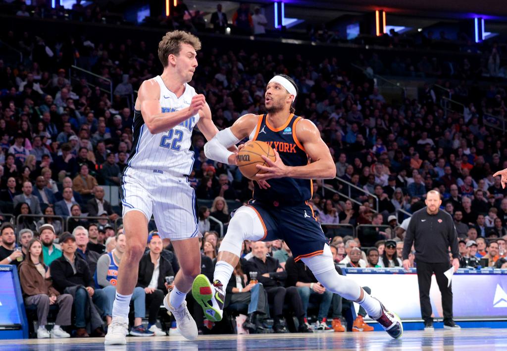 Josh Hart drives to the basket as Franz Wagner #22 of the Orlando Magic defends during the second quarter.