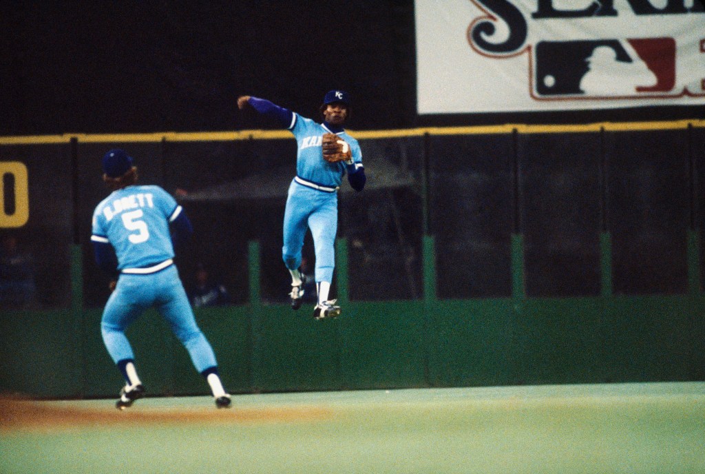 U.L. Washington #30 of the Kansas City Royals throwing a baseball during the 1980 World Series against the Philadelphia Phillies.