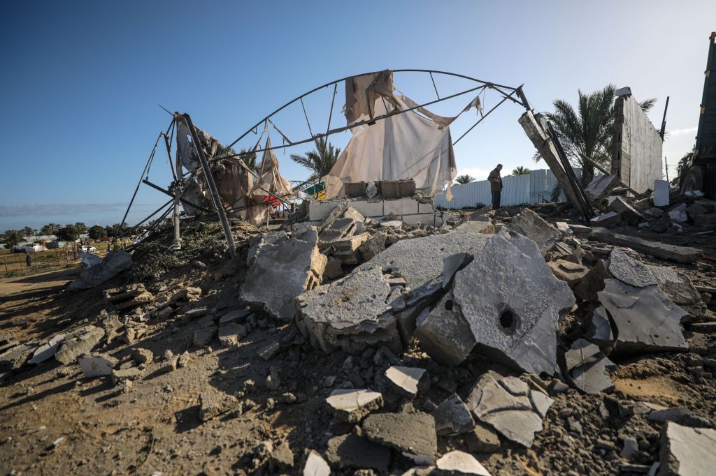 A displaced Palestinians inspect his destroyed shelters following an overnight Israeli tanks shelling in the west of Khan Younis town southern Gaza Strip on, 10 March 2024.