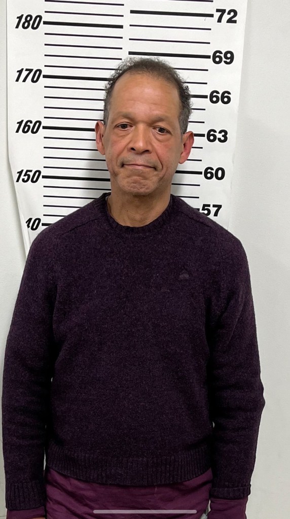 Juan Rondon in a mug shot after he was arrested at his Bronx apartment.