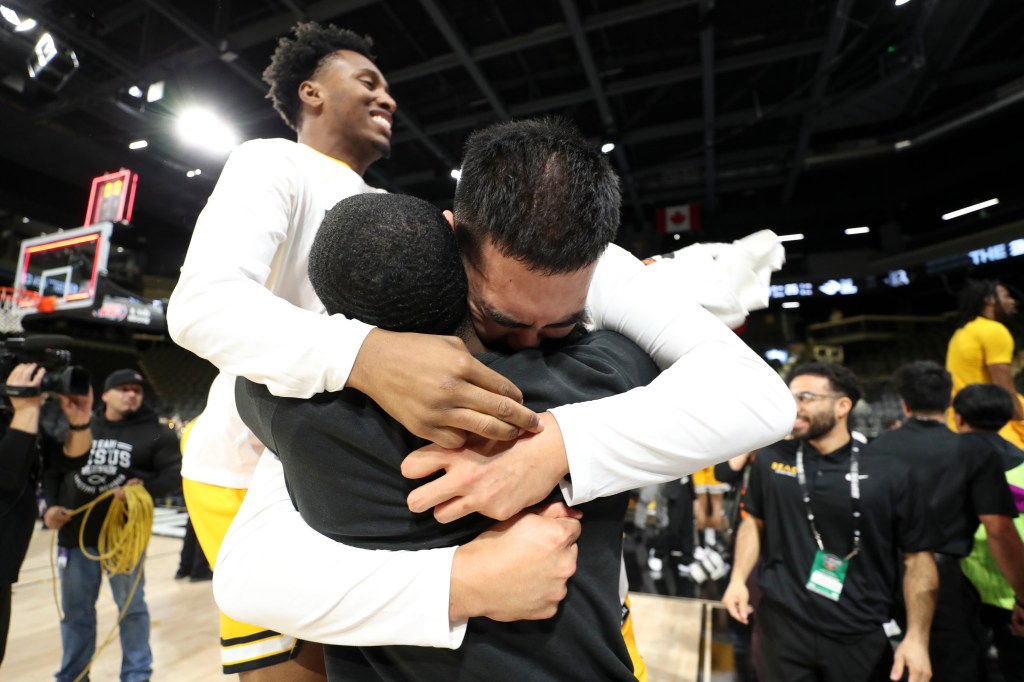 Long Beach State players celebrate winning the Big West championship.