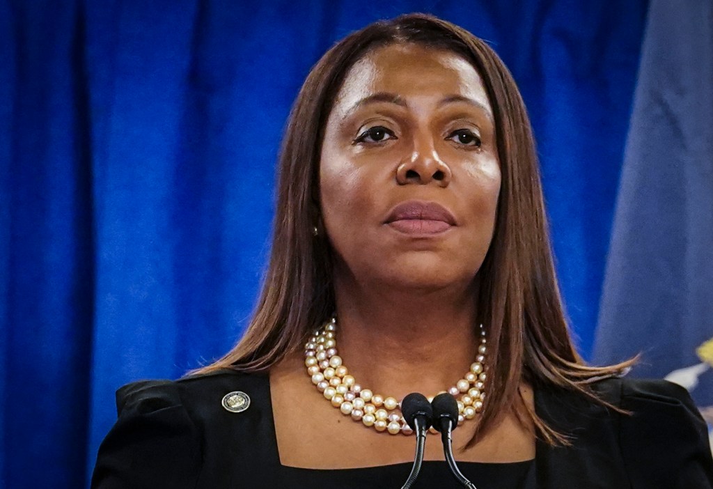 New York Attorney General Letitia James wearing a pearl necklace and a black shirt at a press briefing regarding Donald Trump's civil business fraud case