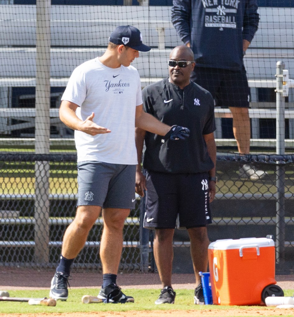 Anthony Rizzo #48, speaking to new hitting coach James Rowson during a workout at the New York Yankees Minor League complex in Tampa Florida.