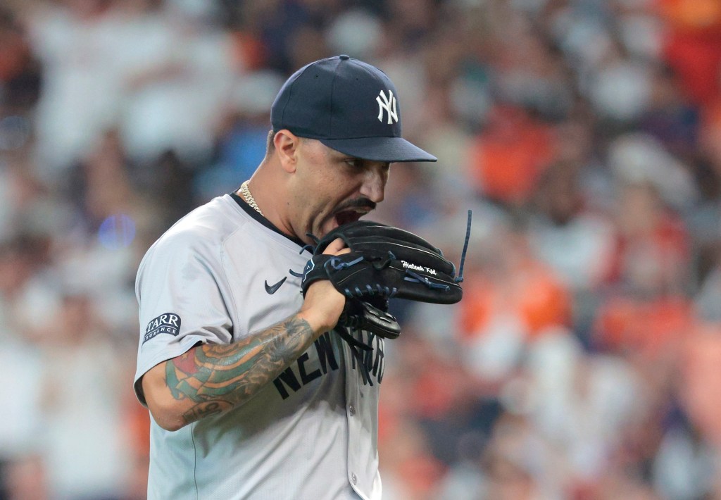 Nestor Cortes #65 of the New York Yankees reacts after ending the first inning.