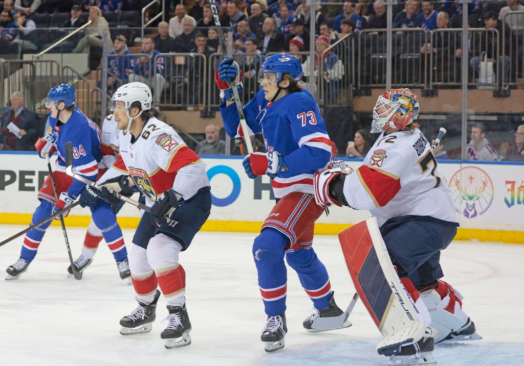 Matt Rempe #73 of the New York Rangers positions himself in front of Sergei Bobrovsky #72 of the Florida Panthers