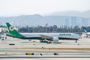 EVA Air Boeing 777-300ER takes off from Los Angeles international Airport on July 30, 2022 in Los Angeles