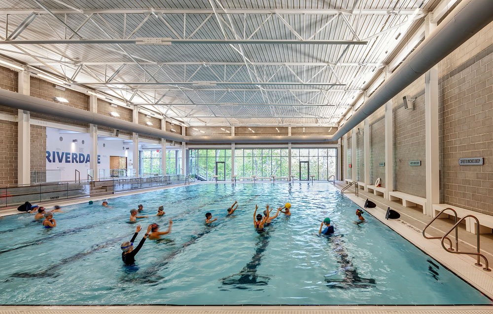 Students swim in a state of the art pool at Riverdale Country School