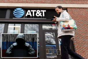 Hacker in a hood, pedestrian walking in front of an AT&T store.