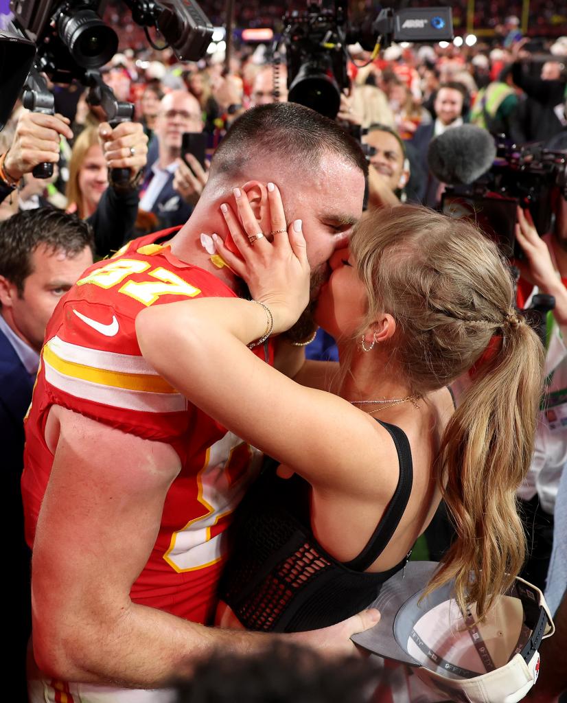 Travis Kelce and Taylor Swift kiss at Super Bowl 2024.