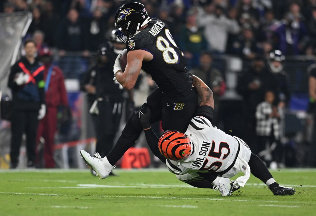 Baltimore Ravens tight end Mark Andrews (89) fights a tackle from Cincinnati Bengals linebacker Logan Wilson (55) during a November 2023 game.