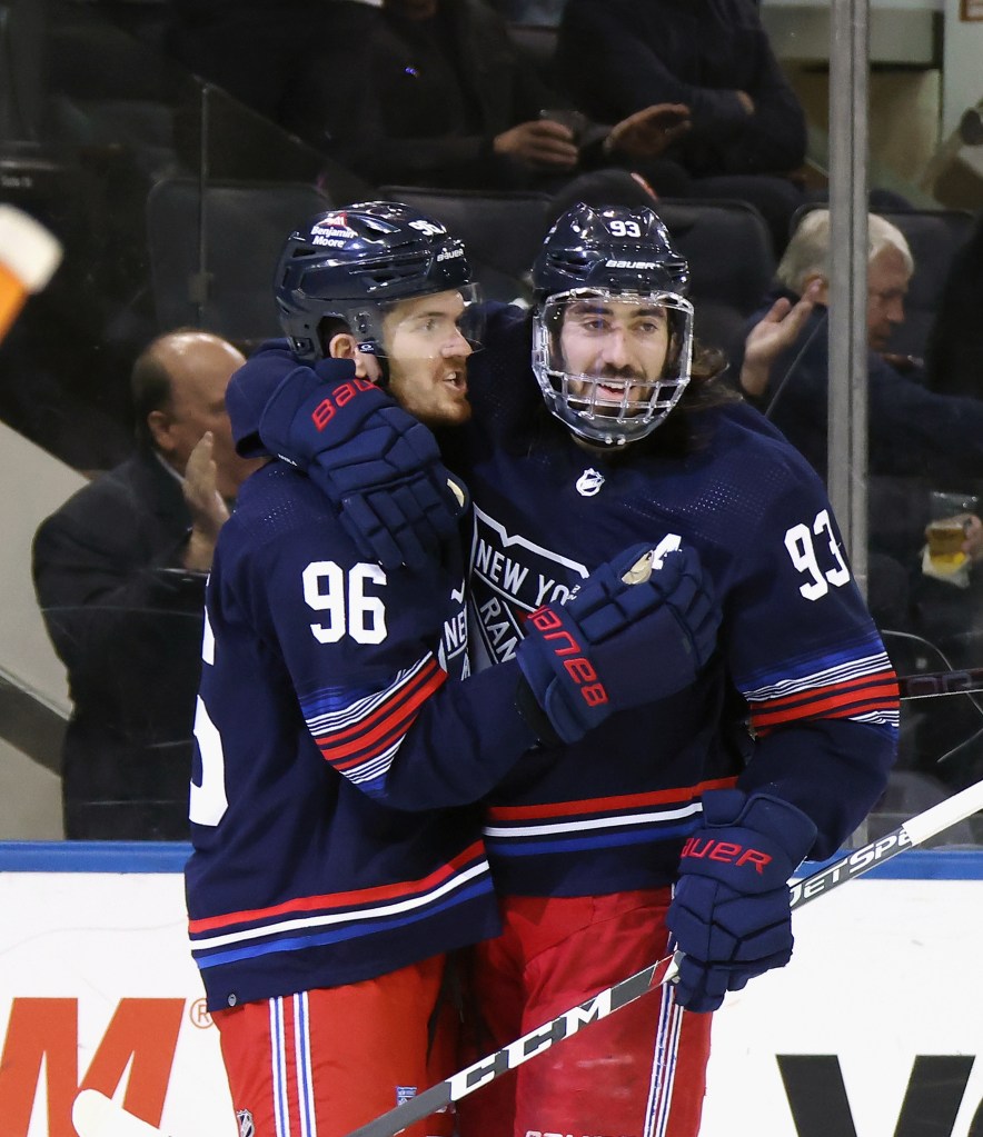 Mika Zibanejad of the Rangers celebrates his second period goal against the Islanders along with Jack Roslovic.