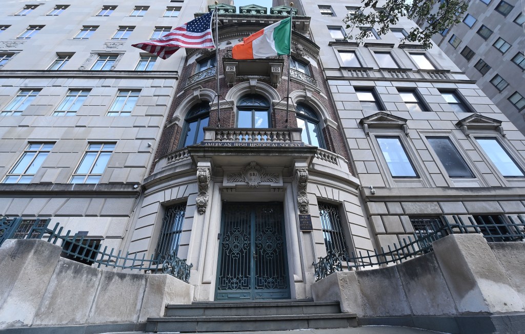 Flags on the front of a building in Upper East Side New York, home of the American Irish Historical Society, threatened with foreclosure.