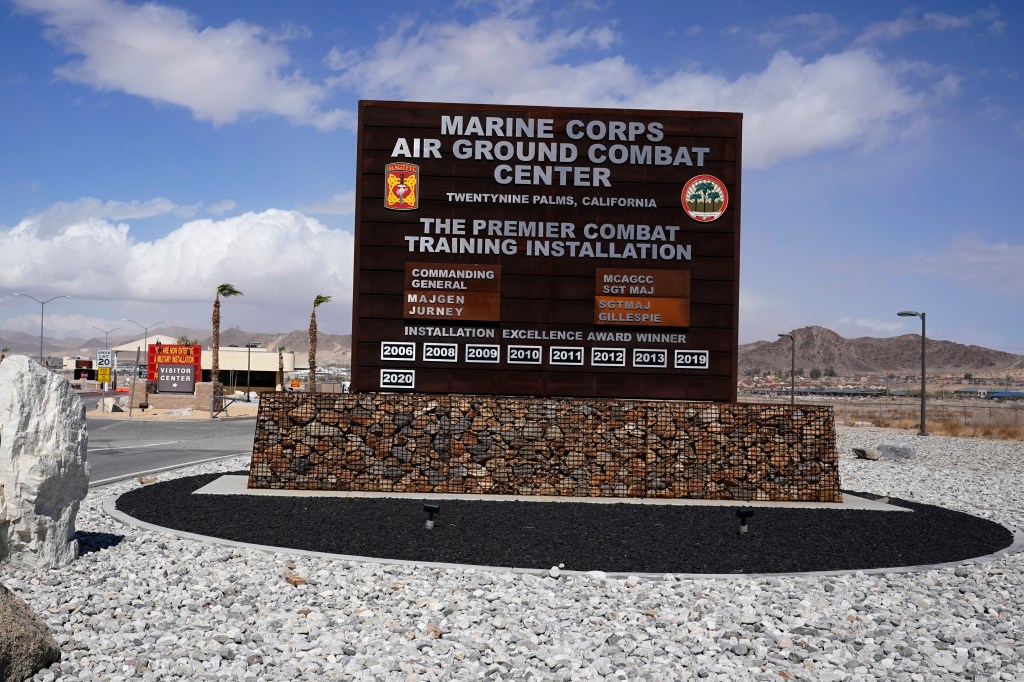 A sign sits at the entrance to the Marine Corps Air Ground Combat Center, Wednesday, March 10, 2021, in Twentynine Palms, Calif. 
