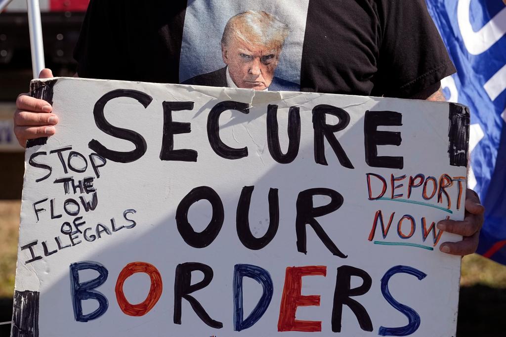 Protest sign that says secure our borders