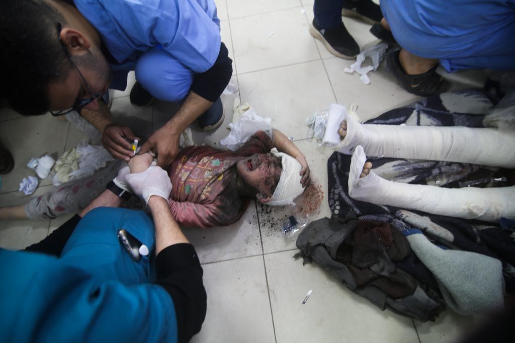 Wounded Palestinians receiving medical treatment in a hospital in Rafah, Gaza Strip after Israeli bombardment.