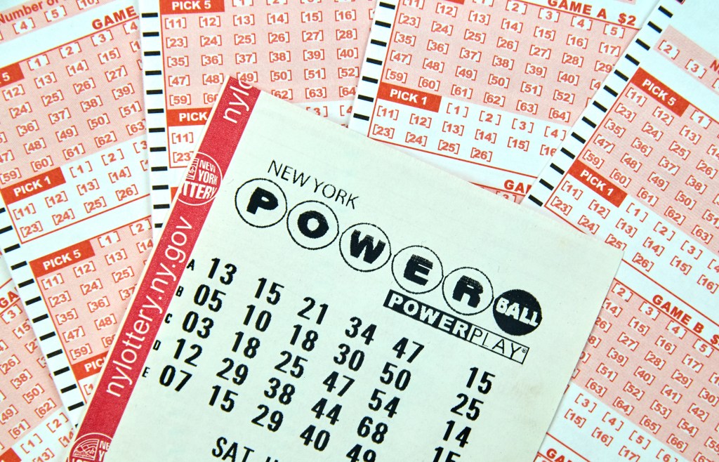 MONTREAL, CANADA - DECEMBER 23, 2016 : Powerball New York lottery tickets. Powerball is an American lottery game offered by 44 states, the District of Columbia, Puerto Rico and the US Virgin Islands.