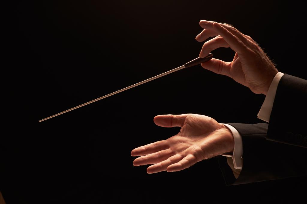 Conductor conducting an orchestra