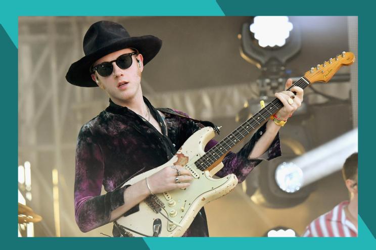 Two Door Cinema Club frontman Alex Trimble rocks out on guitar.