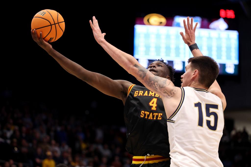 Antwan Burnett, who scored 18 points, goes up for a shot as John Olmstead defends during Grambling State's 88-81 OT win over Montana State in the First Four. 