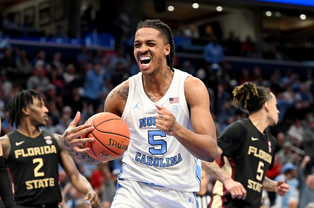 Armando Bacot #5 of the North Carolina Tar Heels celebrates in the first half against the Florida State Seminoles.