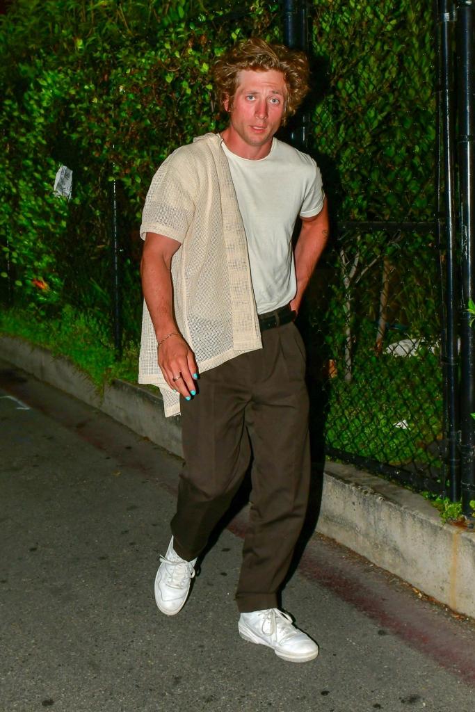 Jeremy Allen White walking on a sidewalk in Beverly Hills.