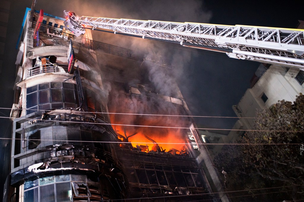 Firefighters work to contain a fire that broke out at a commercial complex in Dhaka, Bangladesh, on Feb. 29, 2024. 