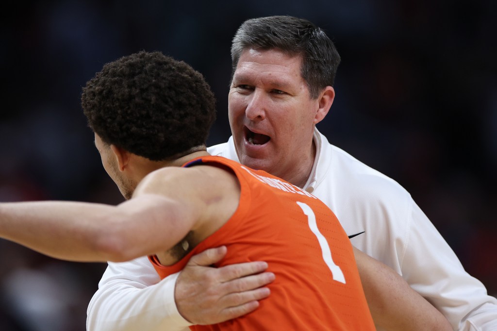 Head coach Brad Brownell of the Clemson Tigers and Chase Hunter #1 of the Clemson Tigers react prior to a game against the Arizona Wildcats in the Sweet 16 round of the NCAA Men's Basketball Tournament.