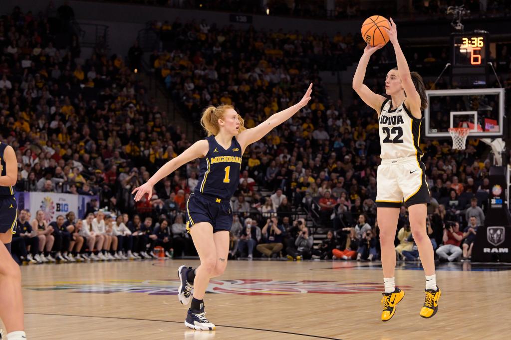 Caitlin Clark shoots a 3-pointer over Lauren Hansen during the second half of Iowa's win.