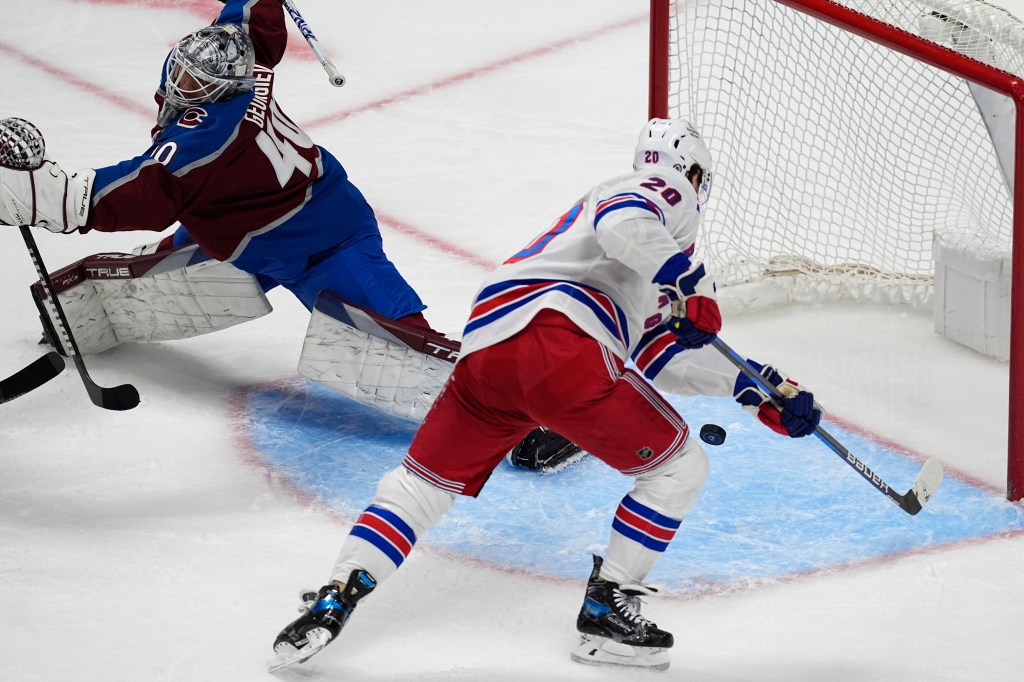 Chris Kreider scores a goal on Alexandar Georgiev during the third period of the Rangers' shootout win.