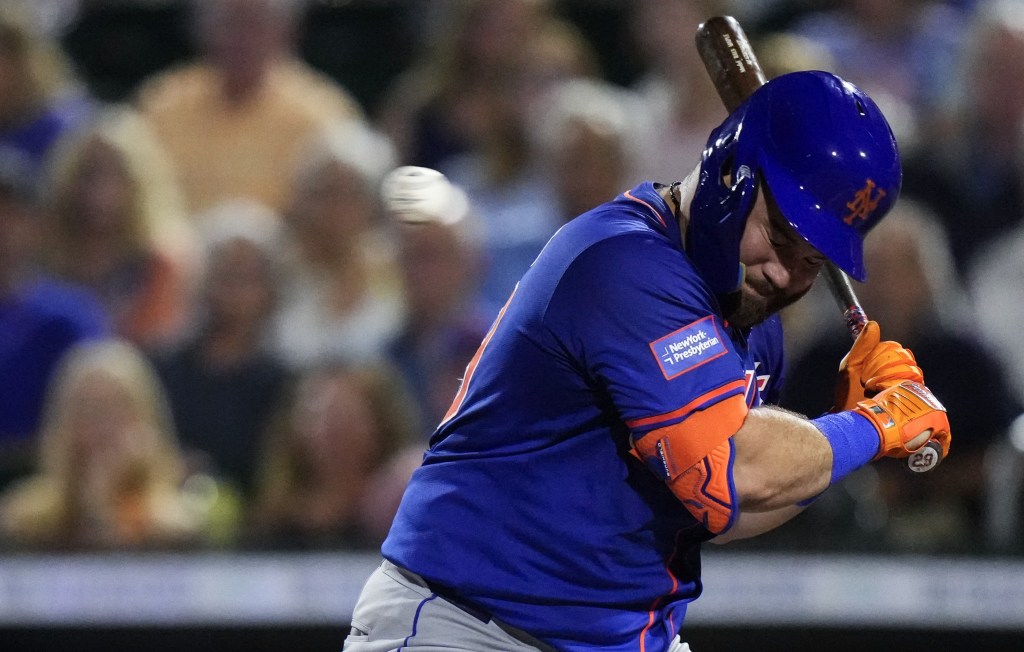 DJ Stewart ducks out of the way of a pitch during the fifth inning of the Mets' 3-1 exhibition win over the Marlins.