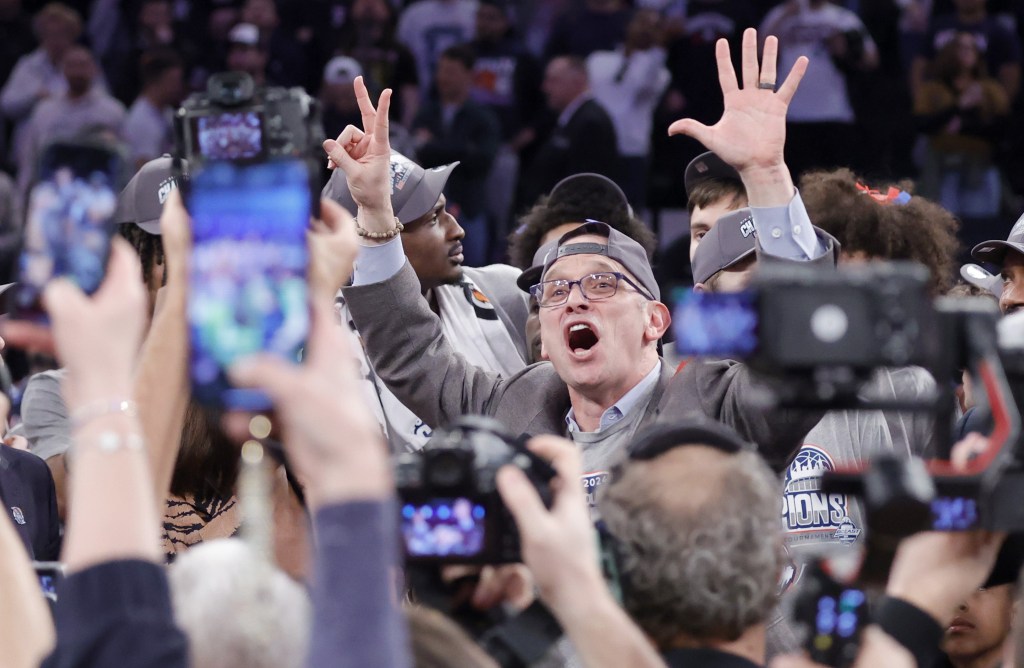 Dan Hurley celebrates after UConn's 73-57 Big East Tournament-clinching victory over Marquette.