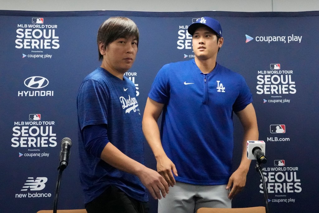 Los Angeles Dodgers' Shohei Ohtani, right, and his interpreter, Ippei Mizuhara, leave after at a news conference ahead of a baseball workout at Gocheok Sky Dome in Seoul, South Korea, Saturday, March 16, 2024.