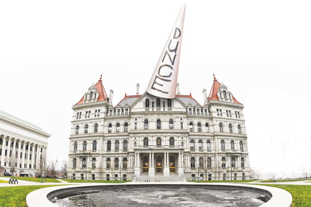 NY State Capitol building with pointed tip in the background.