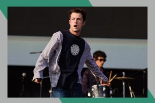 Wallows frontman Dylan Minnette looks at the crowd from the stage.