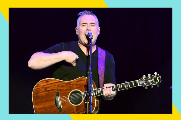 Barenaked Ladies frontman Ed Robertson jams out onstage.