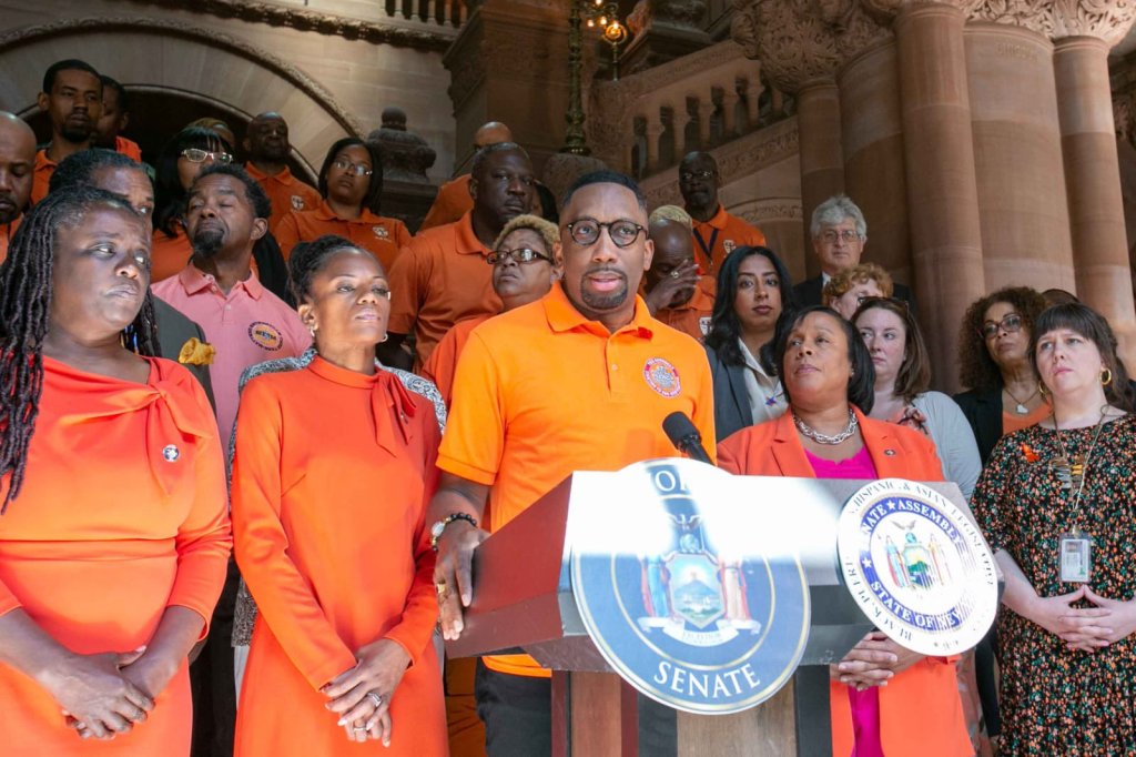 a group of people standing at a podium