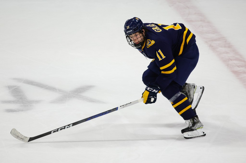 Collin Graf #11 of the Quinnipiac Bobcats skates against the Boston University Terriers.