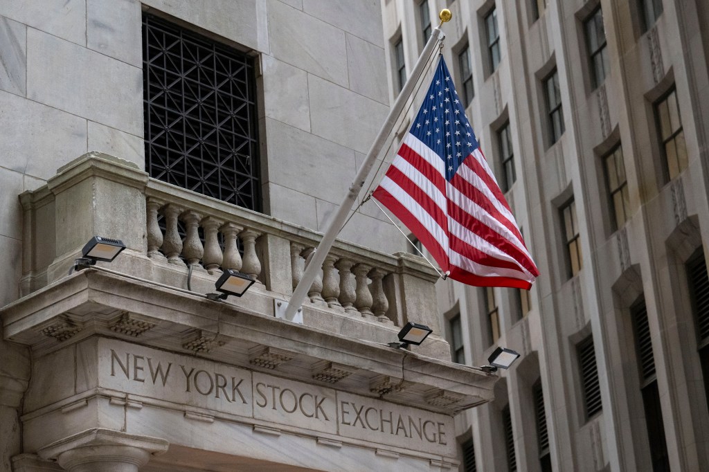 Exterior view of the New York Stock exchange building with a flag on it in Wall Street on January 31, 2024.
