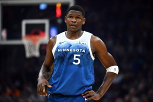 Anthony Edwards #5 of the Minnesota Timberwolves talks to a teammate during the first quarter against the Cleveland Cavaliers.