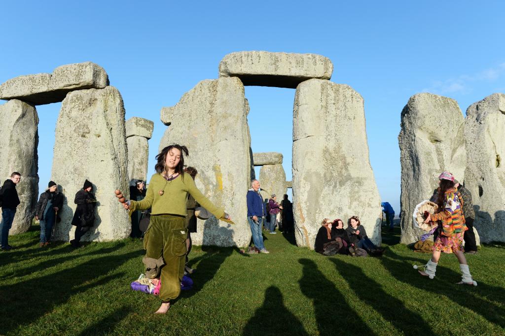 Revellers dance and play music during celebrations marking the spring equinox at Stonehenge.