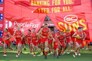 Gold Coast Suns enter the field prior to the 2024 AFL Opening Round match between the Gold Coast SUNS and the Richmond Tigers at People First Stadium on March 09, 2024.