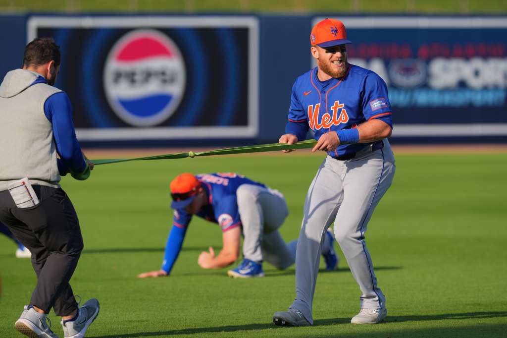 Harrison Bader, stretching before the Mets' exhibition game, is one of the reasons the team is better defensively, according to Francisco Lindor.