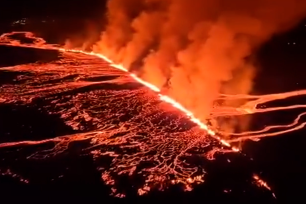 A volcano in Iceland that erupted on March 16 for the fourth time since December was still spewing smoke and bright orange lava into the air three days later.