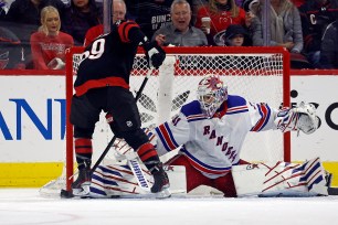 Igor Shesterkin makes a save on Jake Guenzel during the Rangers' 1-0 win over the Hurricanes.