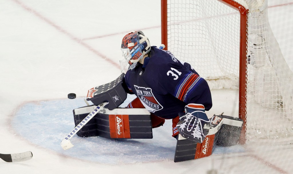 Igor Shesterkin makes of his 30 saves during the Rangers' shootout win.