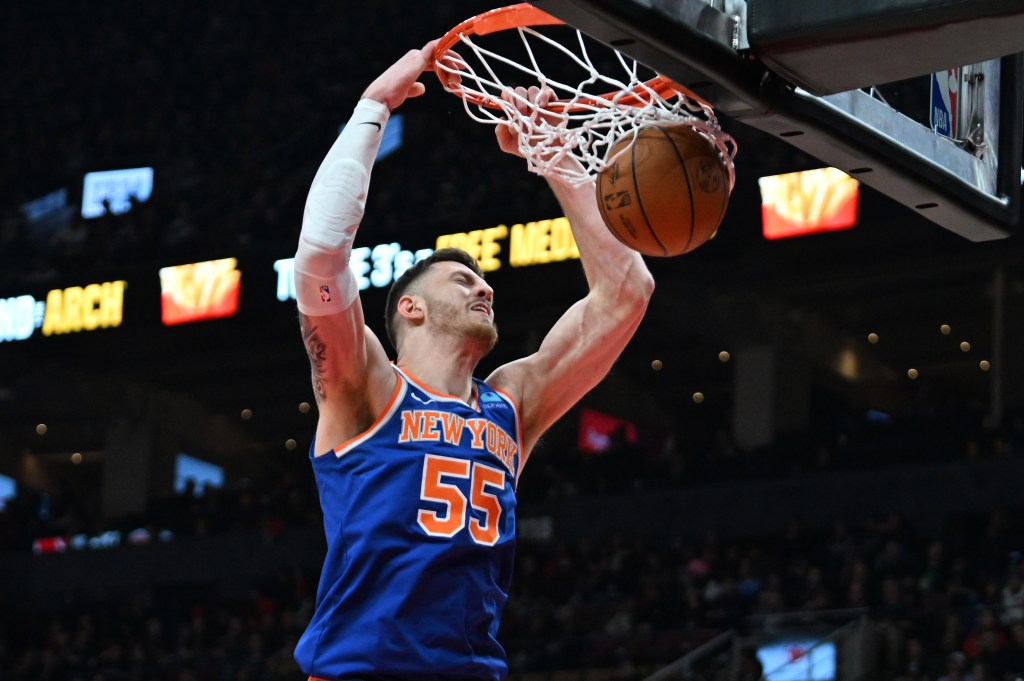 Isaiah Hartenstein, who scored 15 points, slams home a dunk during the Knicks' win. 